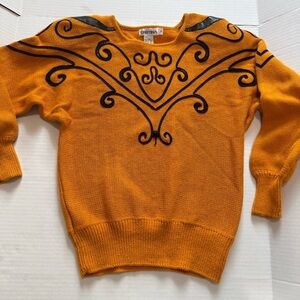 Christina Mustard Sweater with Black appliqué detail. Shoulder pads.